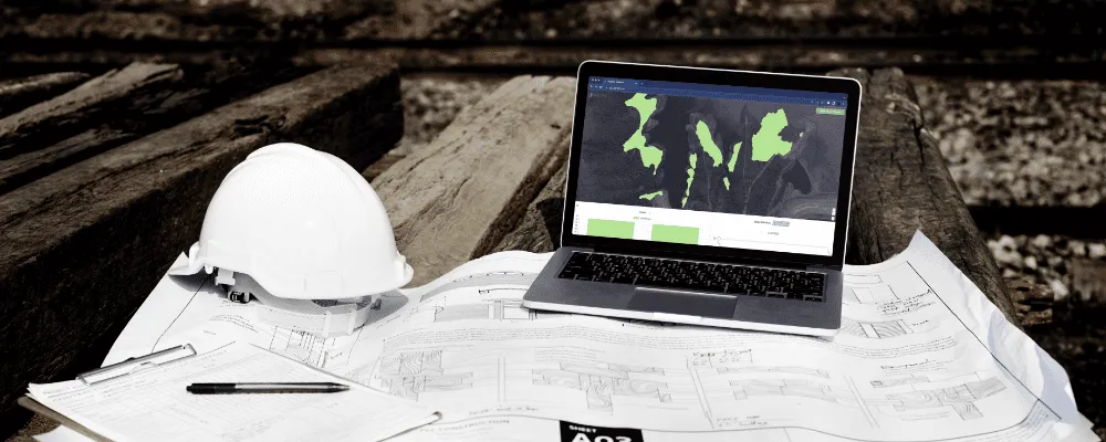 Photograph of Picterra being used on a laptop in a mining environment